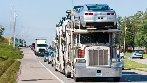 Car carrier truck on highway in traffic